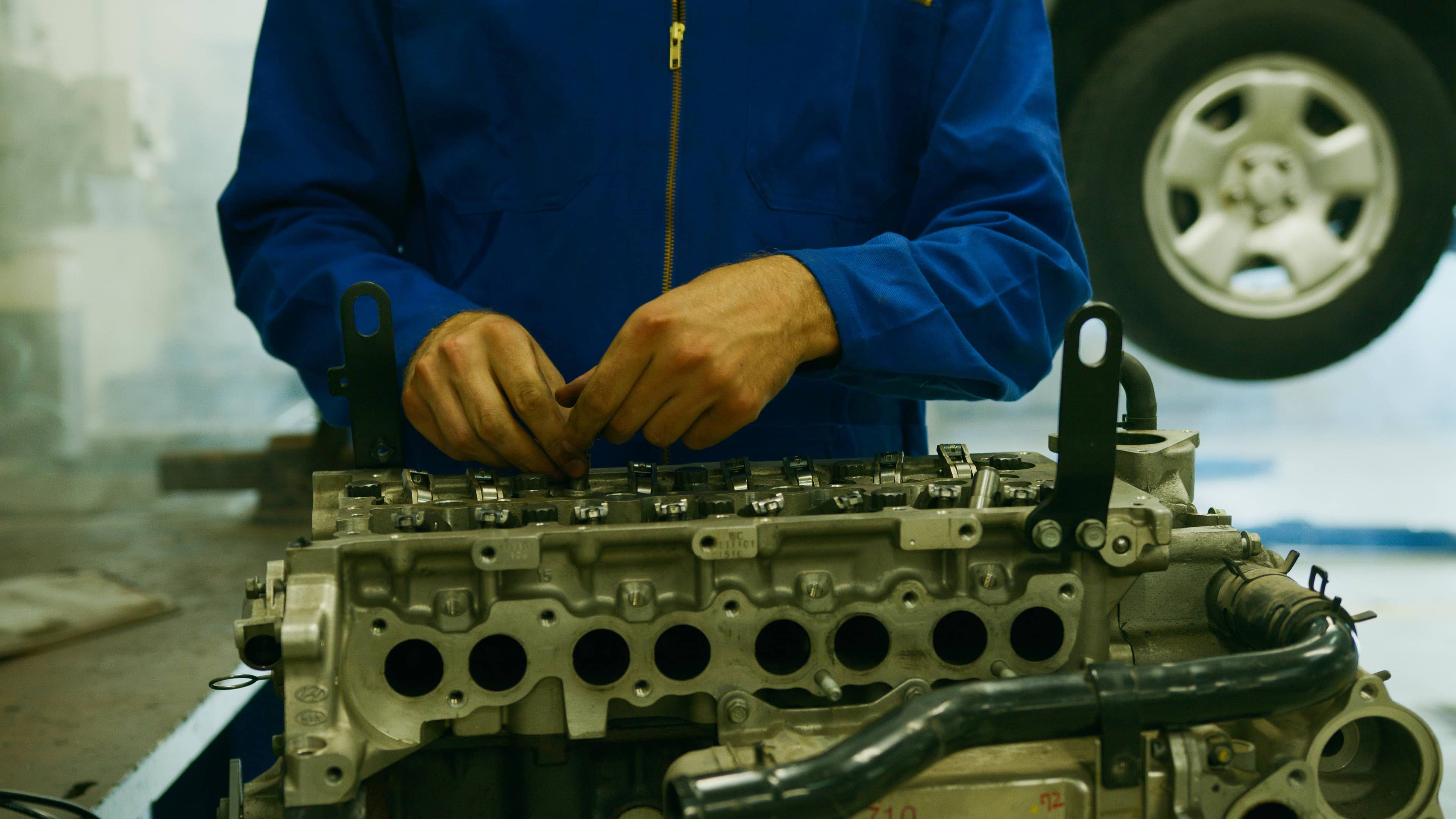 Professional automotive technician performing diagnostic work